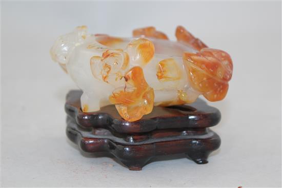 A Chinese chalcedony brush washer, 19th / 20th century, 8.4cm, wood stand